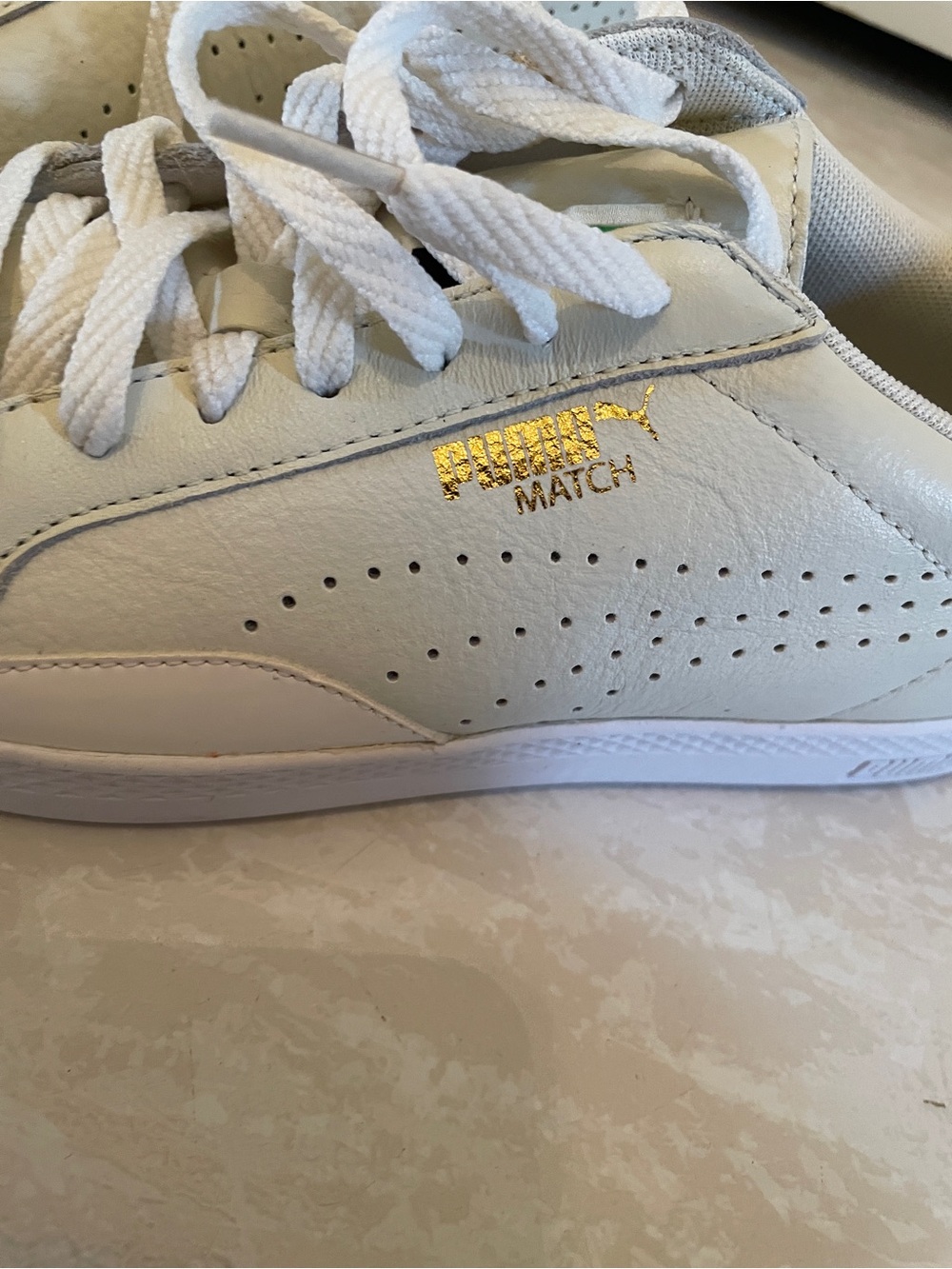 Puma White Leather Sneakers with Gold Logo Accent